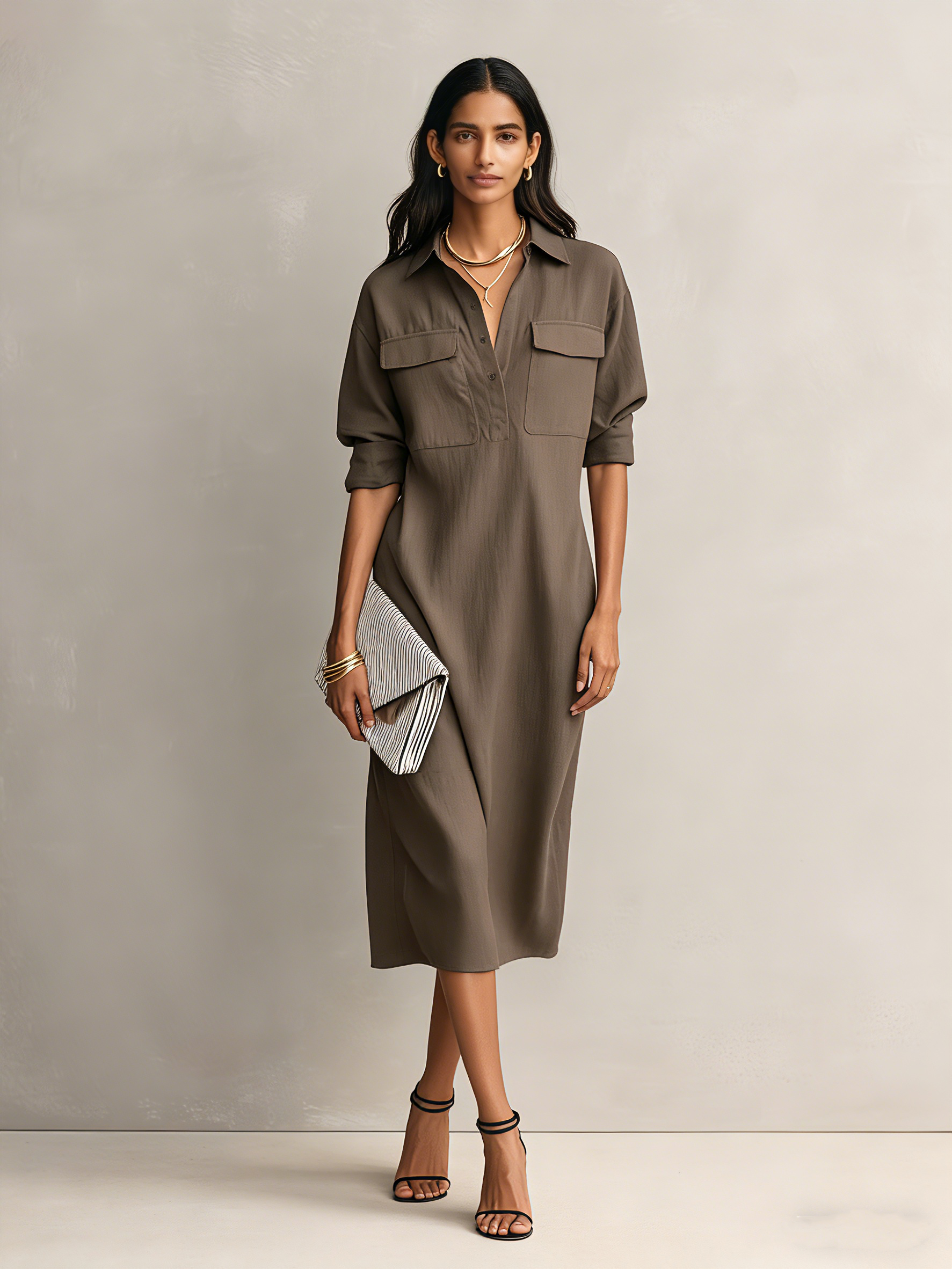 Cool Brown - Model wearing a relaxed fit, long-sleeve midi shirtdress with a collar, chest pockets, and side pockets against a neutral background.