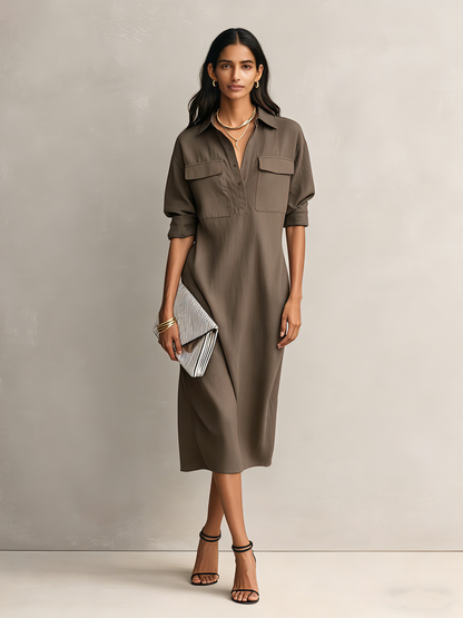 Cool Brown - Model wearing a relaxed fit, long-sleeve midi shirtdress with a collar, chest pockets, and side pockets against a neutral background.