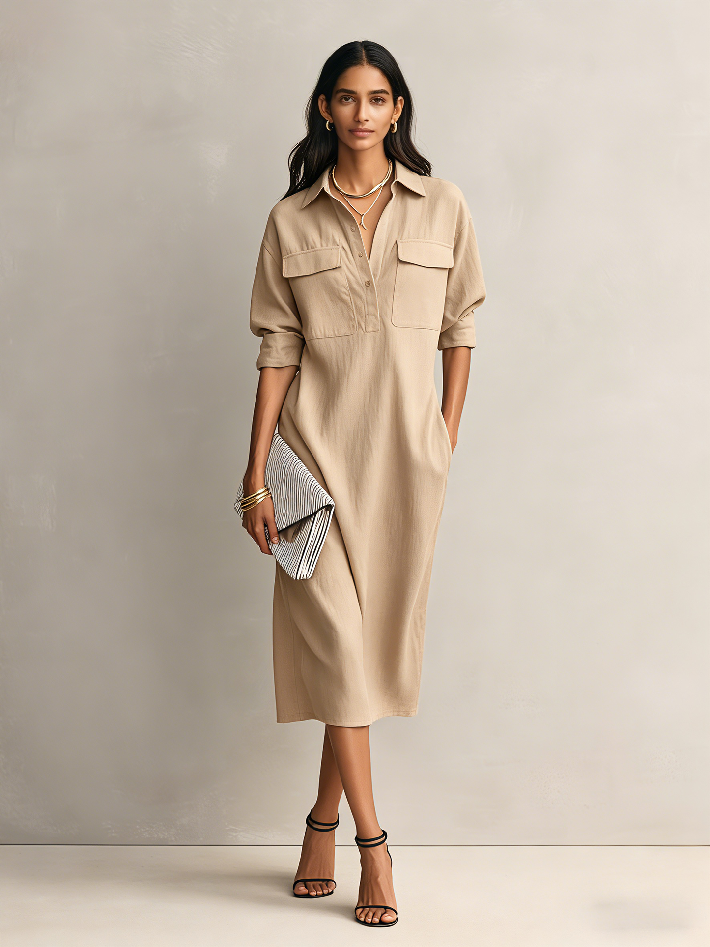 Apricot - Model wearing a relaxed fit, long-sleeve midi shirtdress with a collar, chest pockets, and side pockets against a neutral background.