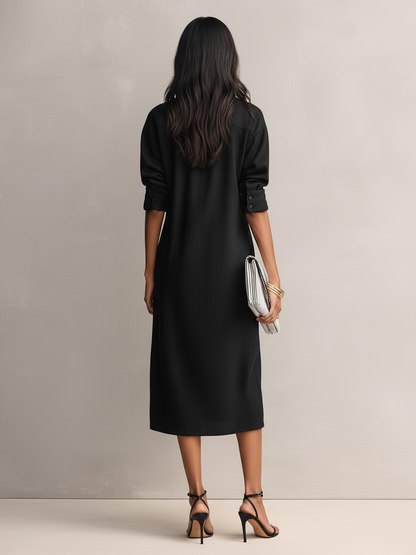 Apricot - Model wearing a relaxed fit, long-sleeve midi shirtdress with a collar, chest pockets, and side pockets against a neutral background.