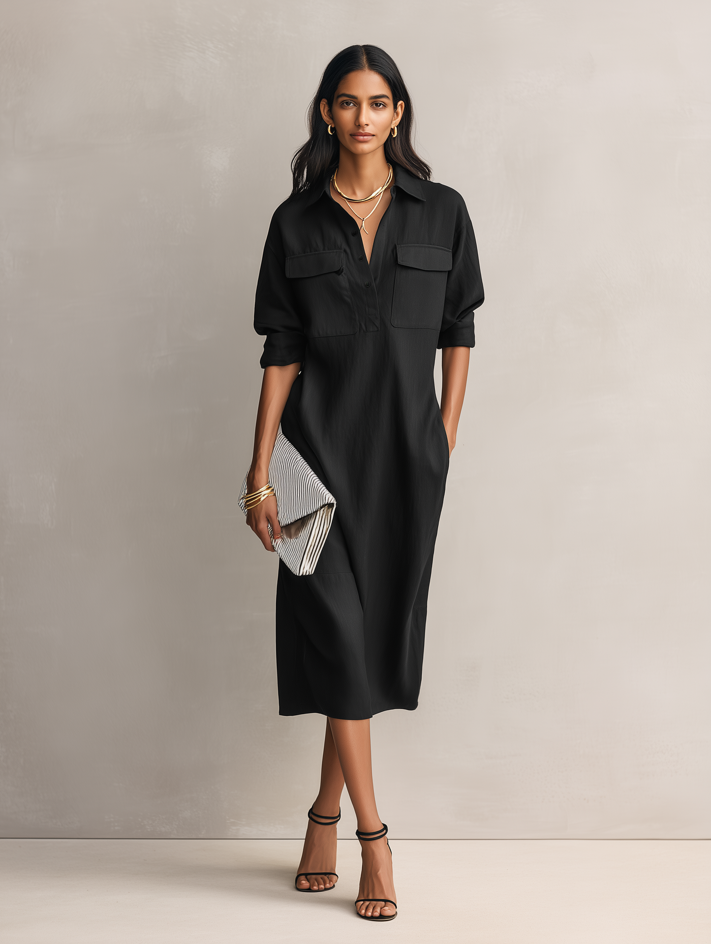 Apricot - Model wearing a relaxed fit, long-sleeve midi shirtdress with a collar, chest pockets, and side pockets against a neutral background.