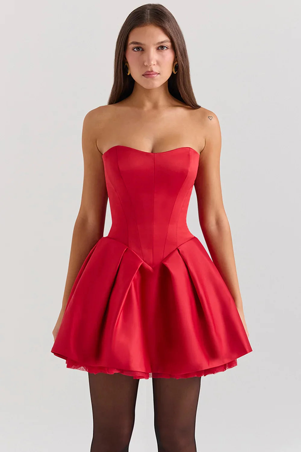 Woman wearing red strapless satin mini dress