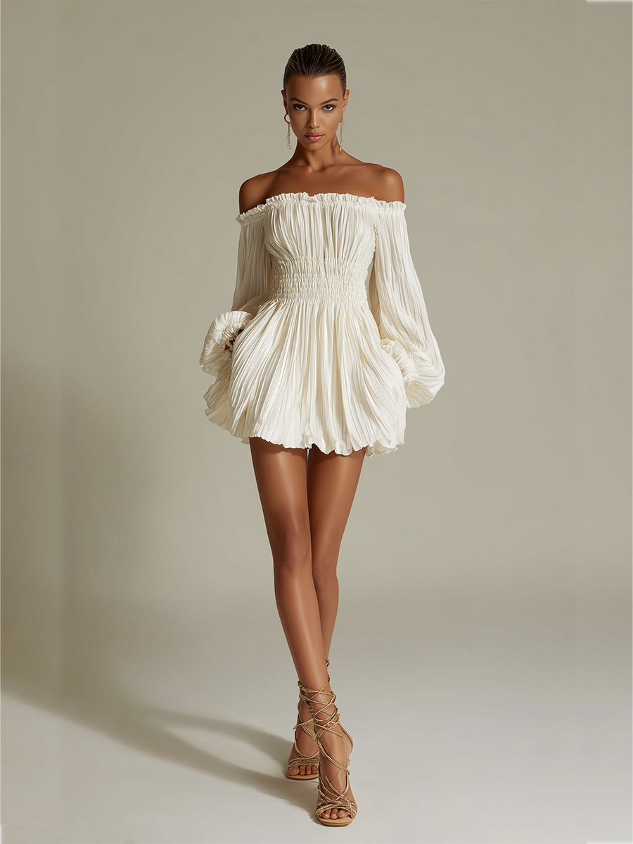 Ivory - Woman wearing a textured off-the-shoulder mini dress with long voluminous balloon sleeves and a smocked waist, standing against a studio background.