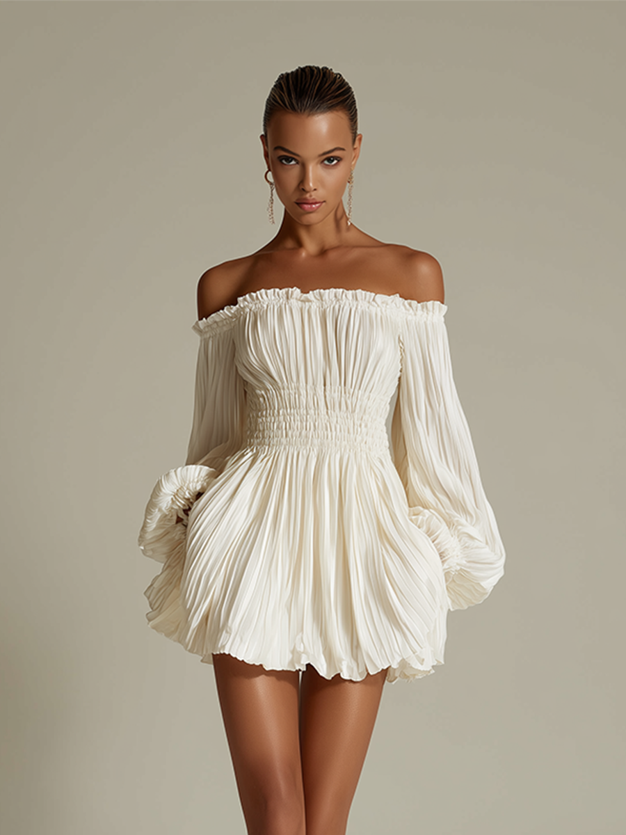 Ivory - Woman wearing a textured off-the-shoulder mini dress with long voluminous balloon sleeves and a smocked waist, standing against a studio background.