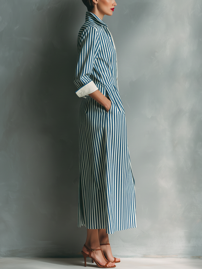 Black And White - Model wearing a striped button-down midi shirtdress with a collar, long sleeves, and a contrast chest pocket.