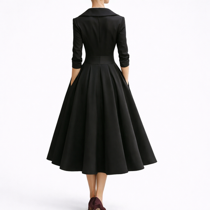 Black - Woman wearing a structured A-line midi dress with a wide portrait collar, wrap bodice, 3/4 sleeves, and a full pleated skirt with pockets.