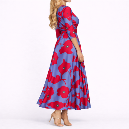 Red & Blue - Woman wearing a satin-finish floral A-line maxi dress with a wrap V-neckline and 3/4 sleeves.