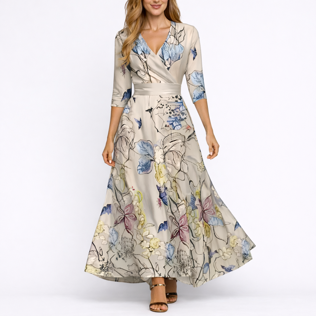 Sand & Beige - Woman wearing a satin-finish floral A-line maxi dress with a wrap V-neckline and 3/4 sleeves.