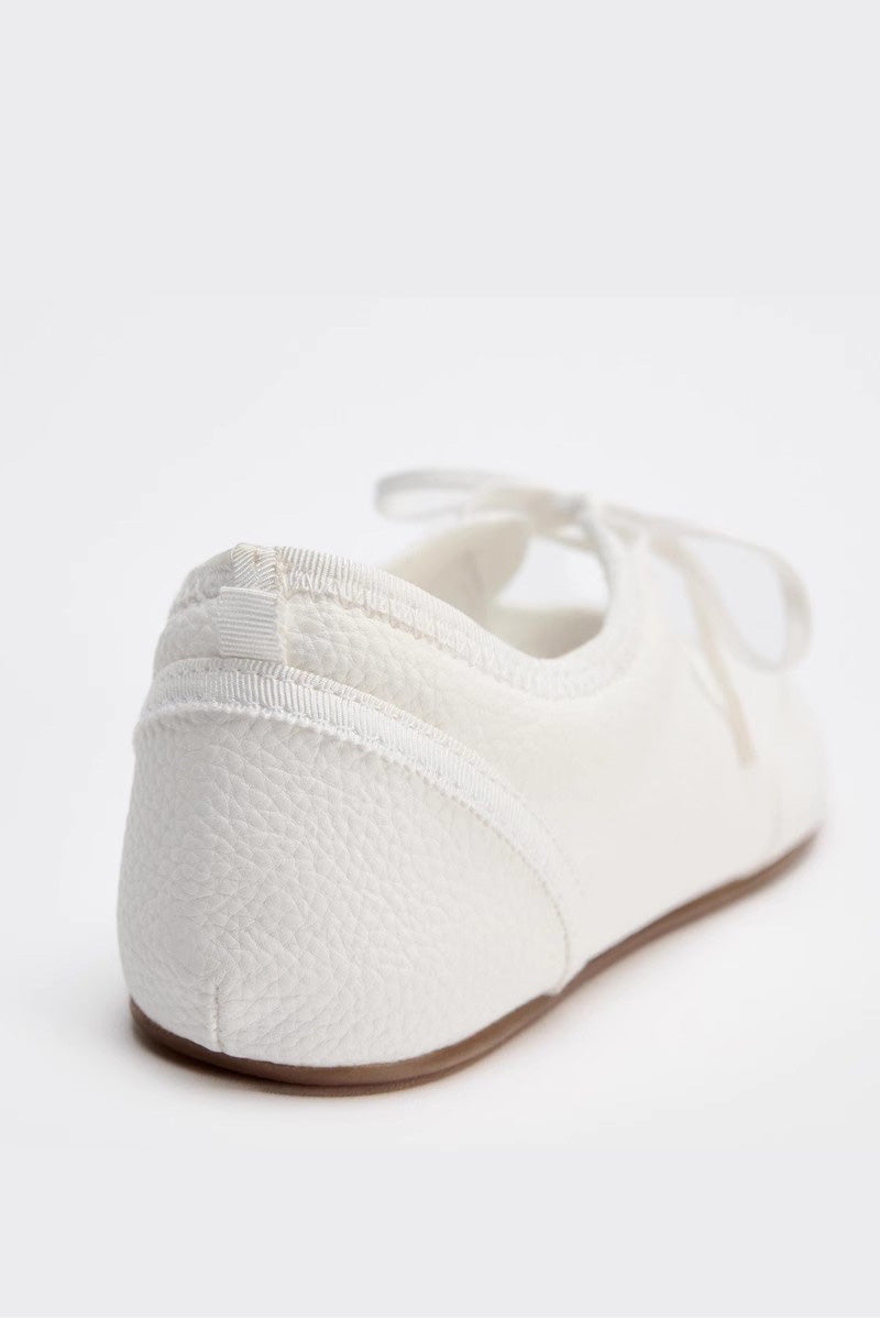 White - Women's white textured faux leather ballet flats with a delicate tie-front detail, viewed from above.