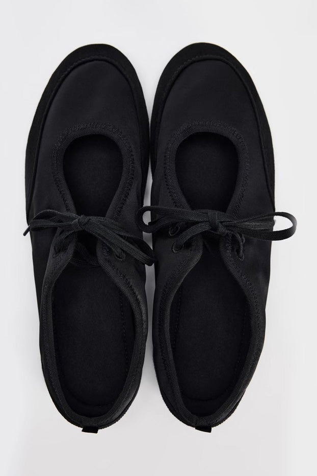 White - Women's white textured faux leather ballet flats with a delicate tie-front detail, viewed from above.