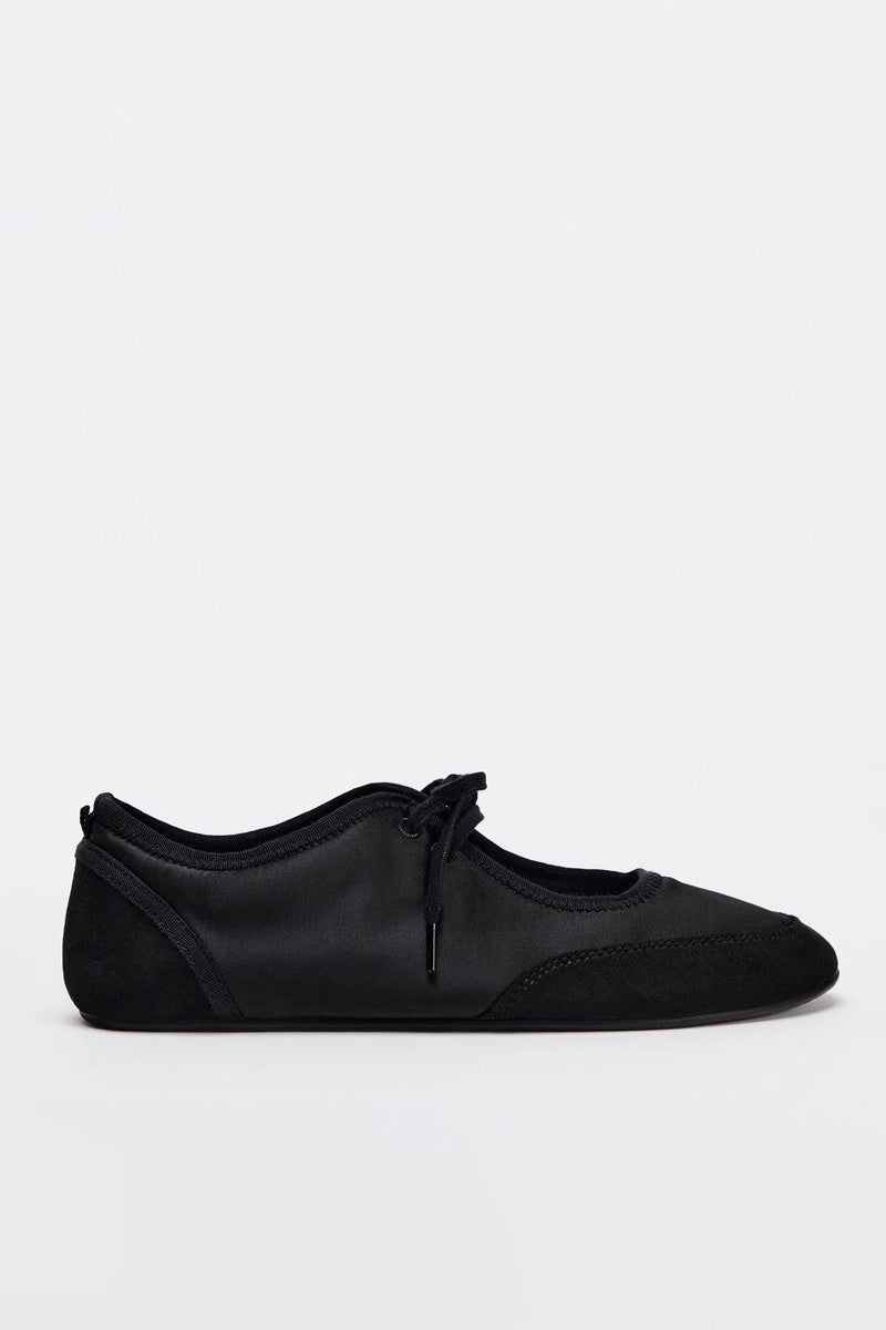 Black - Women's white textured faux leather ballet flats with a delicate tie-front detail, viewed from above.