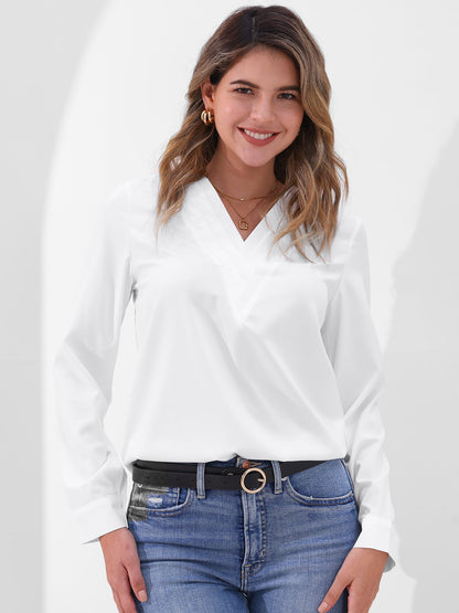 Pink - Women's long-sleeve blouse featuring a distinctive pleated V-neckline and buttoned cuffs, styled tucked into blue denim jeans.