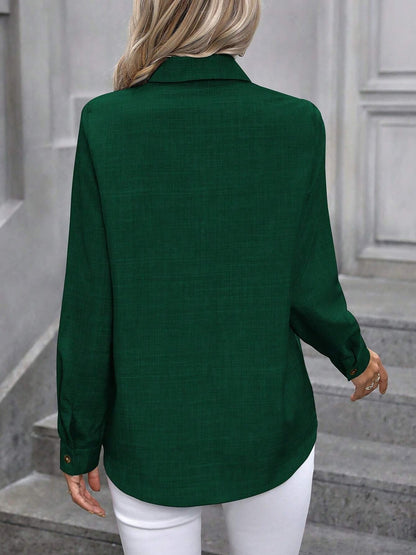 Dark Green - Women's light green long-sleeve button-down blouse with a collar and textured weave, styled tucked into white trousers.