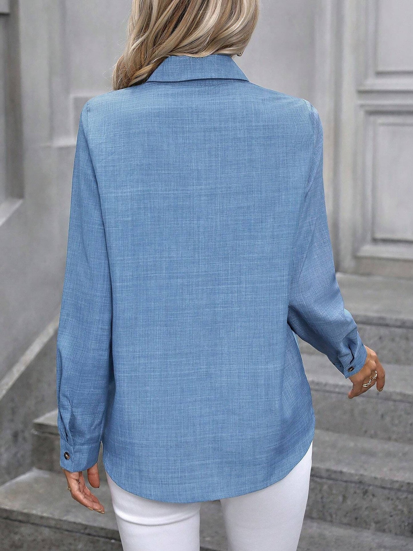 Light Blue - Women's light green long-sleeve button-down blouse with a collar and textured weave, styled tucked into white trousers.