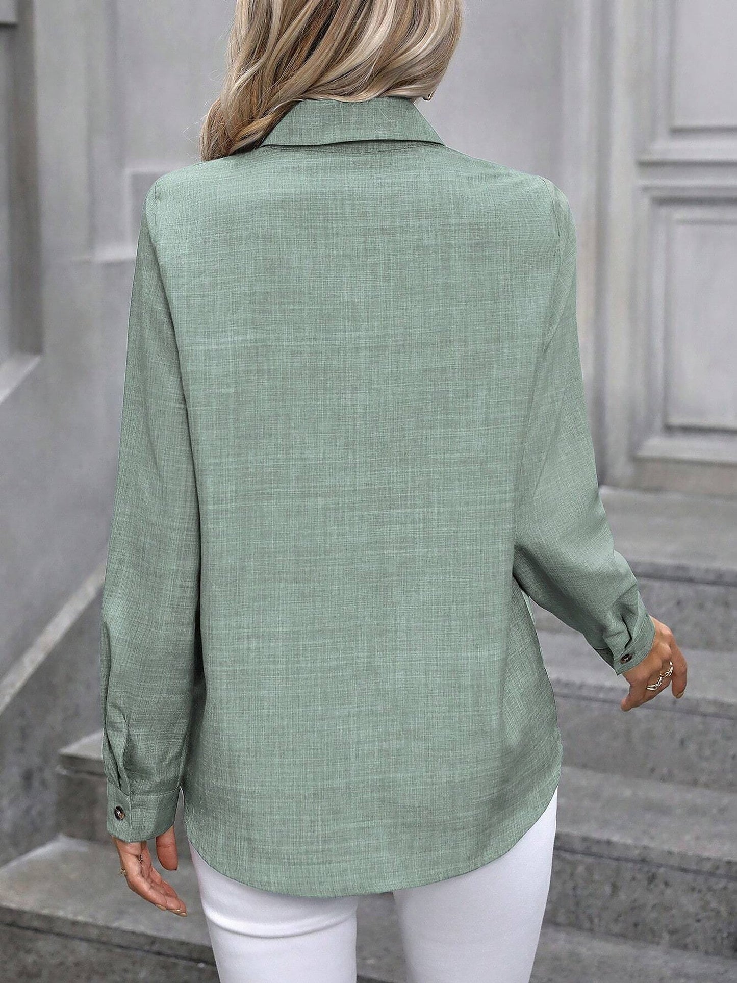 Mint - Women's light green long-sleeve button-down blouse with a collar and textured weave, styled tucked into white trousers.