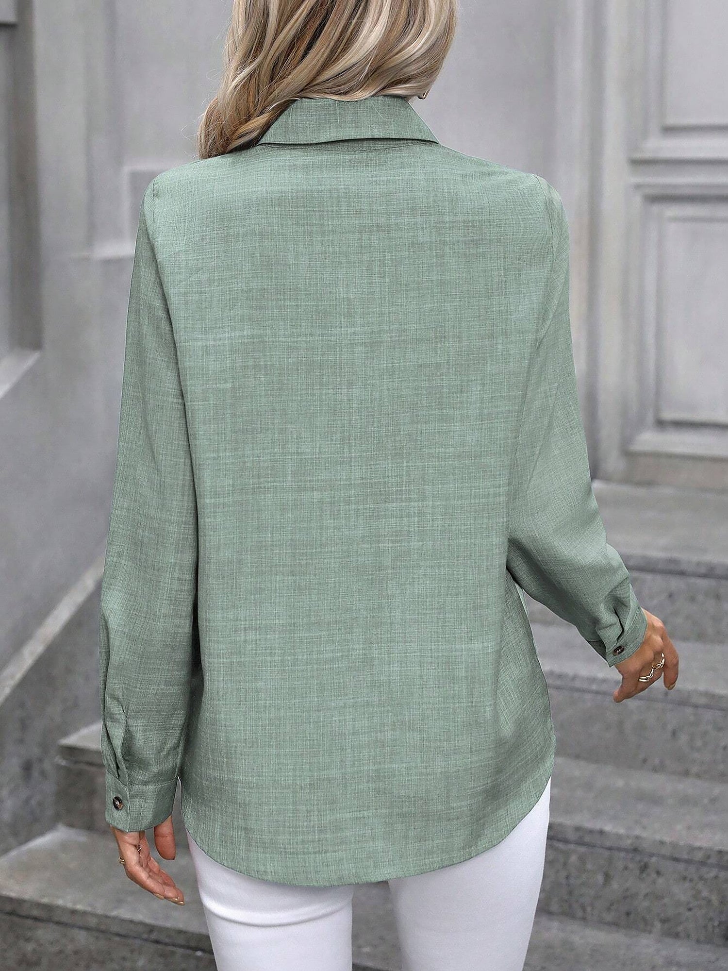 Mint - Women's light green long-sleeve button-down blouse with a collar and textured weave, styled tucked into white trousers.