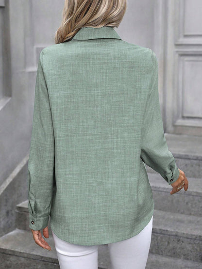 Mint - Women's light green long-sleeve button-down blouse with a collar and textured weave, styled tucked into white trousers.