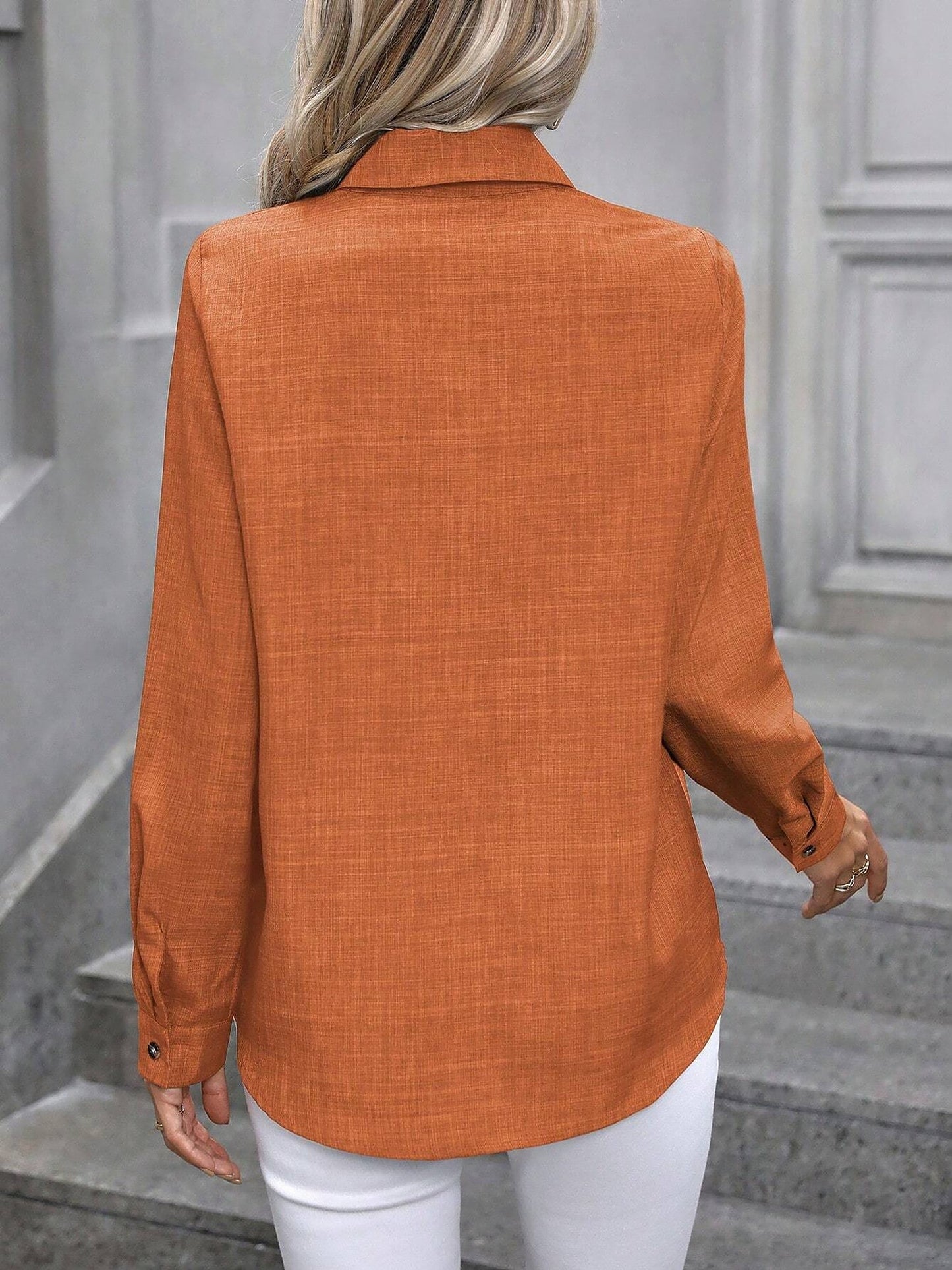 Orange - Women's light green long-sleeve button-down blouse with a collar and textured weave, styled tucked into white trousers.