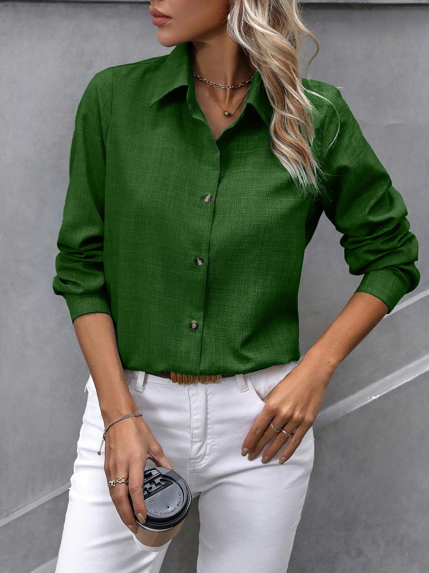 Olive - Women's light green long-sleeve button-down blouse with a collar and textured weave, styled tucked into white trousers.