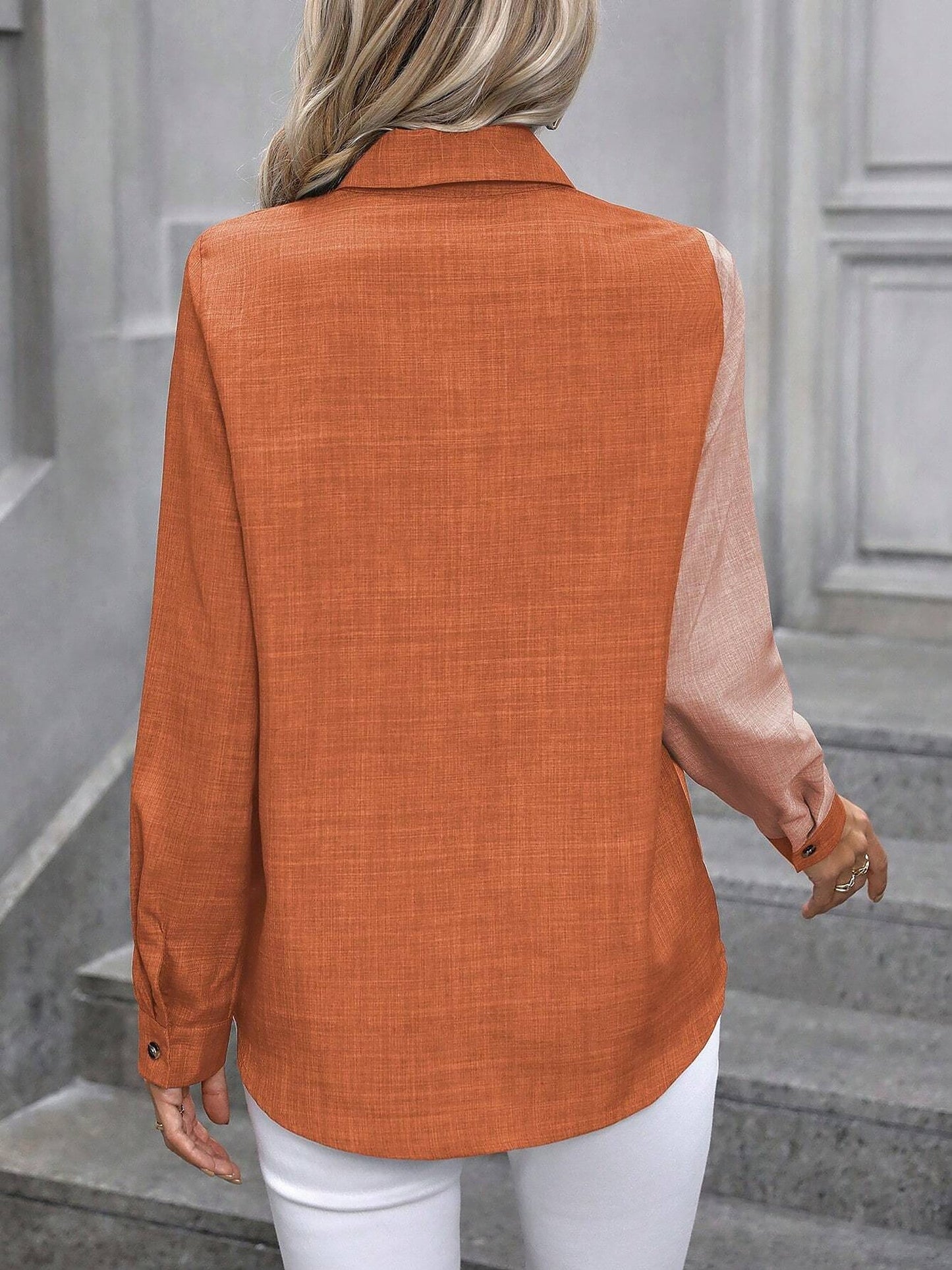 Peach Orange - Women's light green long-sleeve button-down blouse with a collar and textured weave, styled tucked into white trousers.