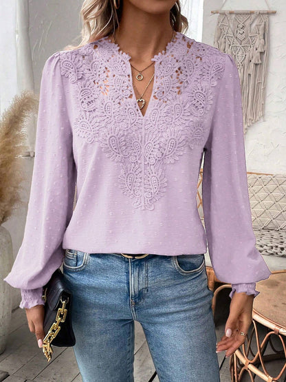 Lavender - Women's dusty rose long-sleeve blouse featuring a lace V-neckline, textured Swiss dot fabric, and smocked cuffs, styled with blue jeans.