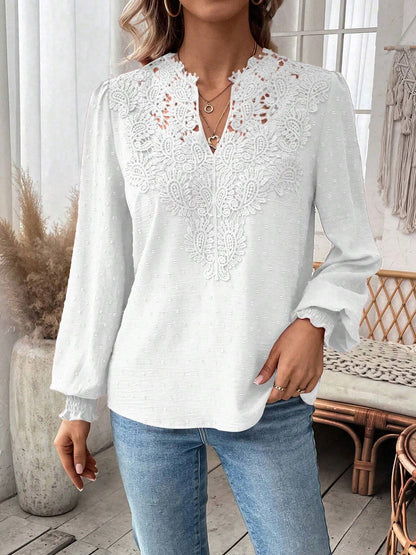 White - Women's dusty rose long-sleeve blouse featuring a lace V-neckline, textured Swiss dot fabric, and smocked cuffs, styled with blue jeans.