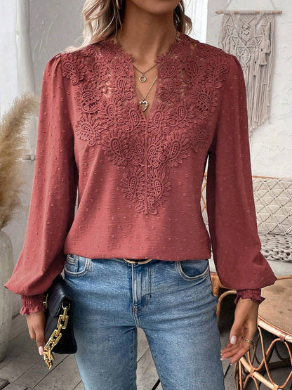 Watermelon Red - Women's dusty rose long-sleeve blouse featuring a lace V-neckline, textured Swiss dot fabric, and smocked cuffs, styled with blue jeans.