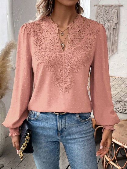 Pink - Women's dusty rose long-sleeve blouse featuring a lace V-neckline, textured Swiss dot fabric, and smocked cuffs, styled with blue jeans.