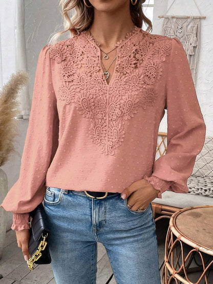 Pink - Women's dusty rose long-sleeve blouse featuring a lace V-neckline, textured Swiss dot fabric, and smocked cuffs, styled with blue jeans.