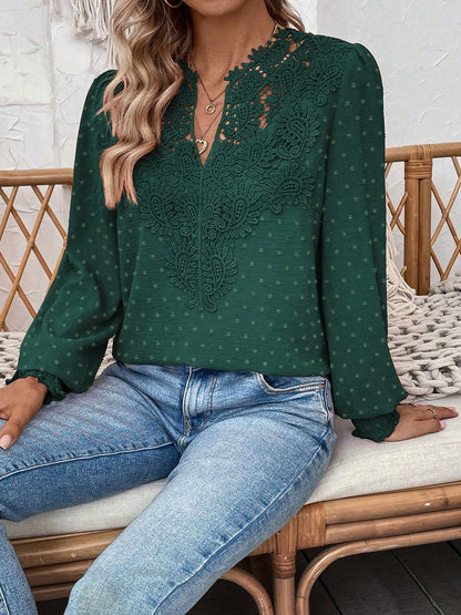 Green - Women's dusty rose long-sleeve blouse featuring a lace V-neckline, textured Swiss dot fabric, and smocked cuffs, styled with blue jeans.