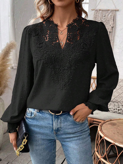 Black - Women's dusty rose long-sleeve blouse featuring a lace V-neckline, textured Swiss dot fabric, and smocked cuffs, styled with blue jeans.