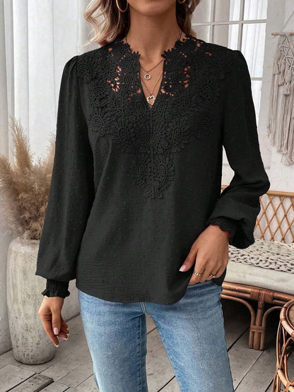 Black - Women's dusty rose long-sleeve blouse featuring a lace V-neckline, textured Swiss dot fabric, and smocked cuffs, styled with blue jeans.