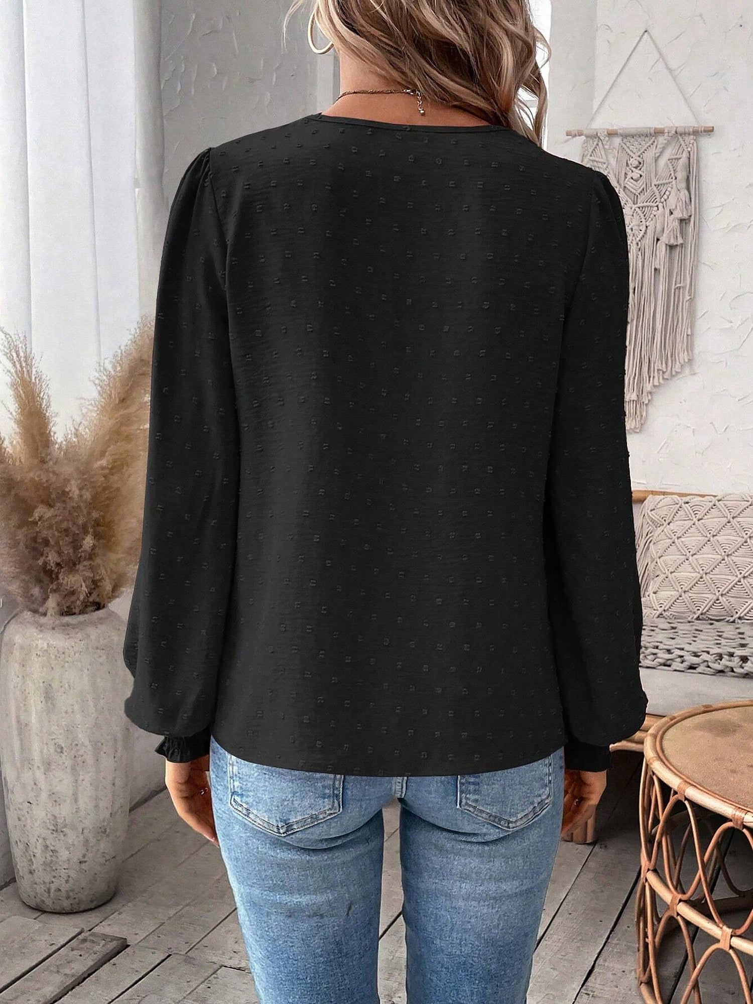Black - Women's dusty rose long-sleeve blouse featuring a lace V-neckline, textured Swiss dot fabric, and smocked cuffs, styled with blue jeans.