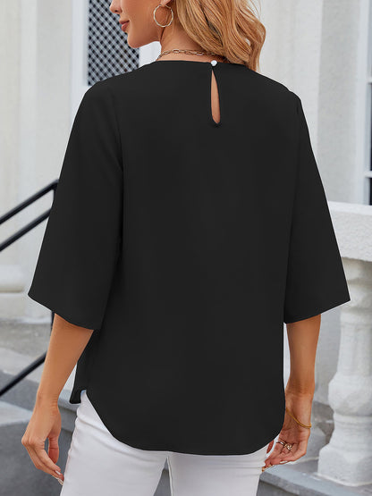 Black - Women's light blue relaxed fit blouse featuring a pleated front neckline and short split sleeves, styled with white trousers.