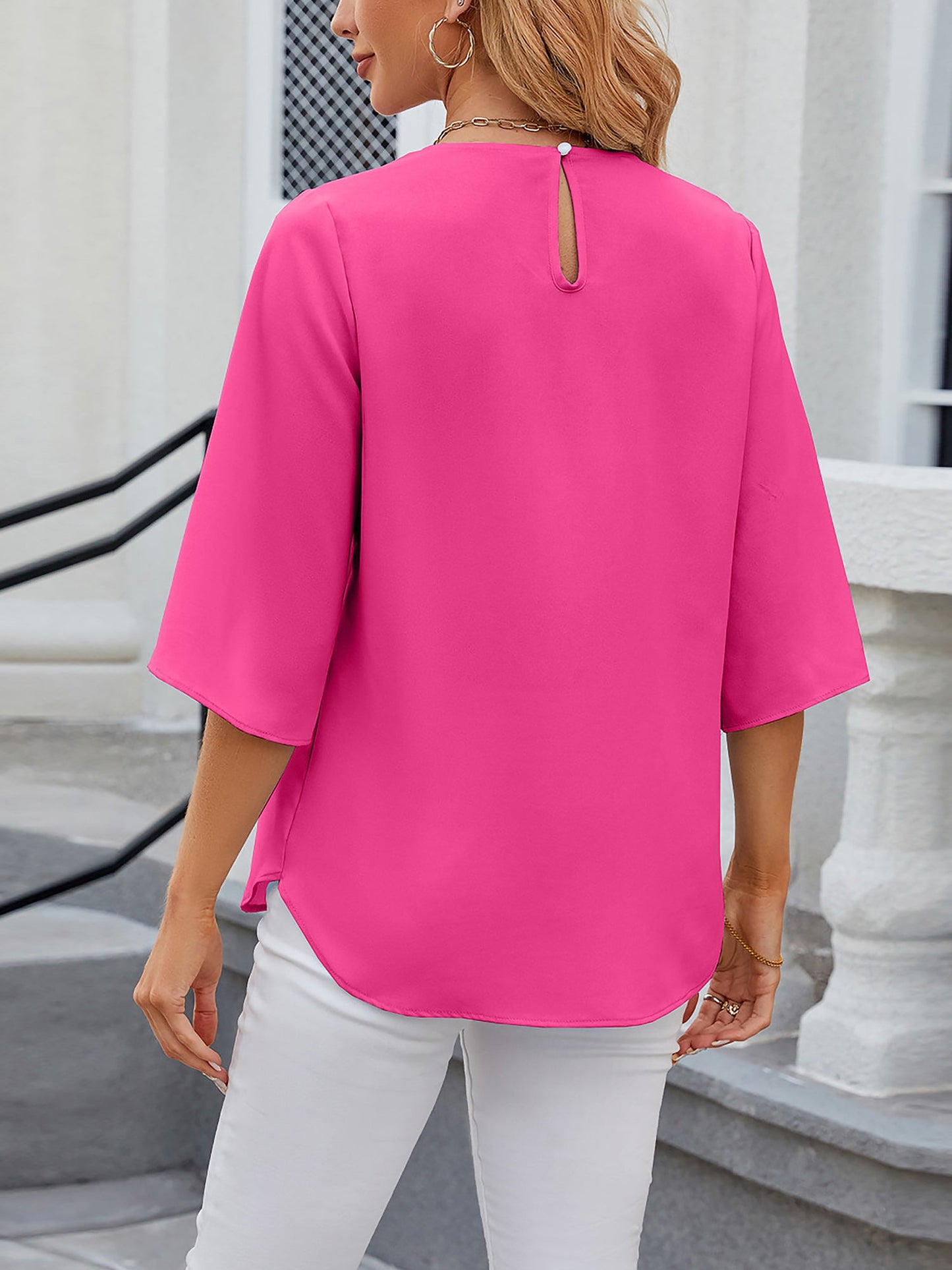 Rose Red - Women's light blue relaxed fit blouse featuring a pleated front neckline and short split sleeves, styled with white trousers.