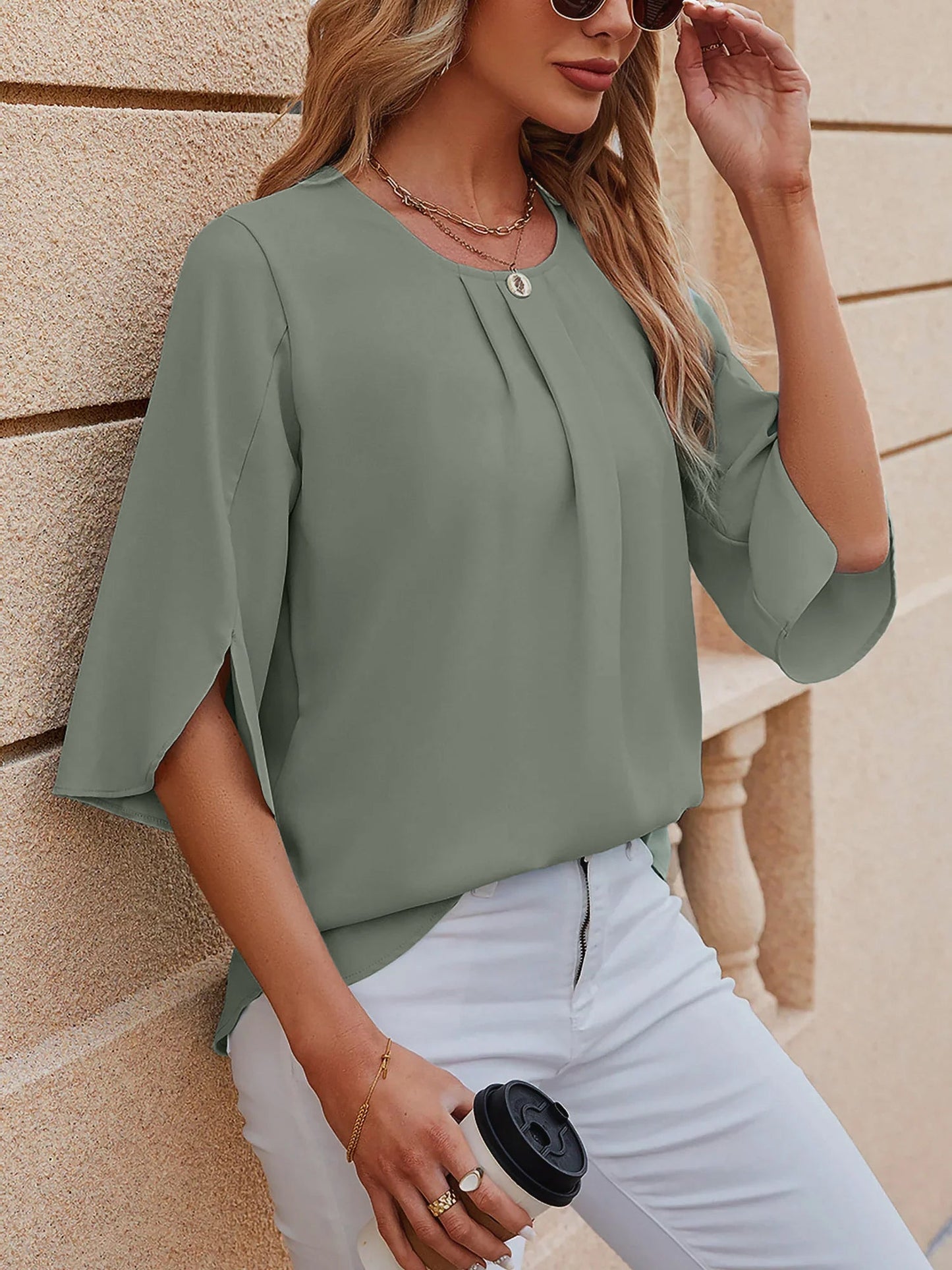 Light Green - Women's light blue relaxed fit blouse featuring a pleated front neckline and short split sleeves, styled with white trousers.