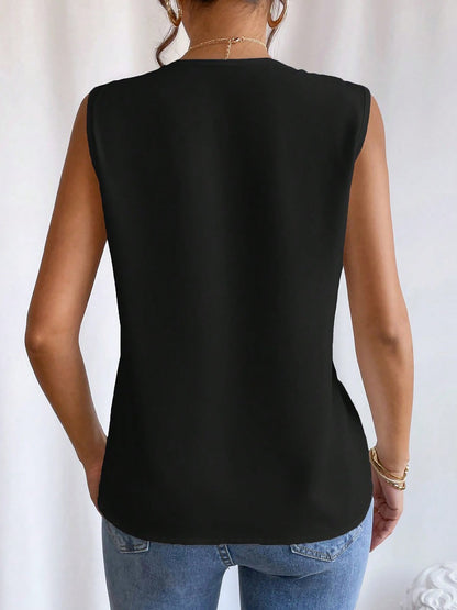 Black - Women's solid white sleeveless blouse featuring a deep V-neckline with layered pleat detailing, styled with blue jeans and a black belt.