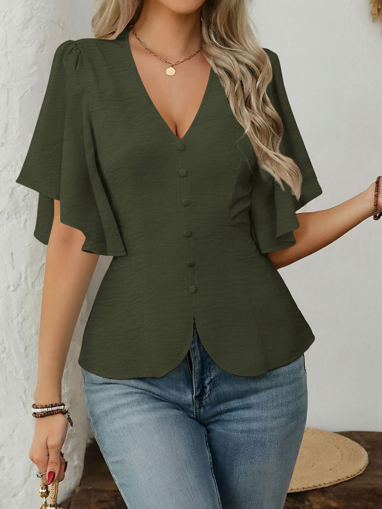 Army Green - Women's rust orange short flutter sleeve blouse featuring a V-neckline, fabric-covered button front, and a tailored peplum waist, styled with blue jeans.