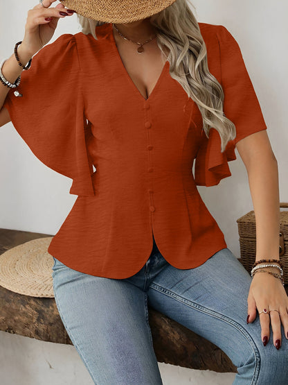 Brown - Women's rust orange short flutter sleeve blouse featuring a V-neckline, fabric-covered button front, and a tailored peplum waist, styled with blue jeans.