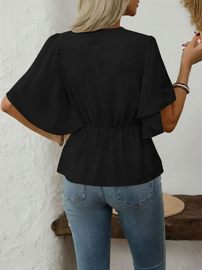 Black - Women's rust orange short flutter sleeve blouse featuring a V-neckline, fabric-covered button front, and a tailored peplum waist, styled with blue jeans.