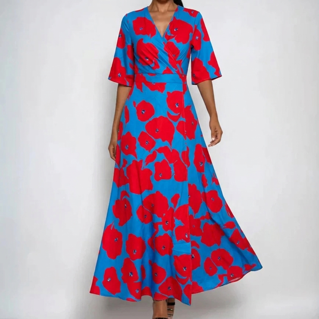 Red - A woman wearing a cream-colored maxi dress featuring a watercolor floral print in blue, purple, and yellow, designed with a surplice V-neck, wide elbow-length sleeves, and a flowing skirt.