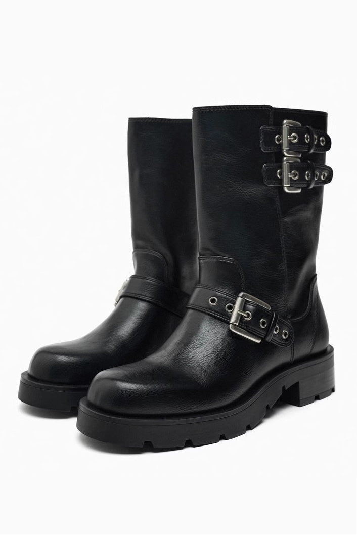 Brown - A pair of women's dark brown faux leather mid-calf moto boots featuring three adjustable buckle straps and a chunky black lug sole.