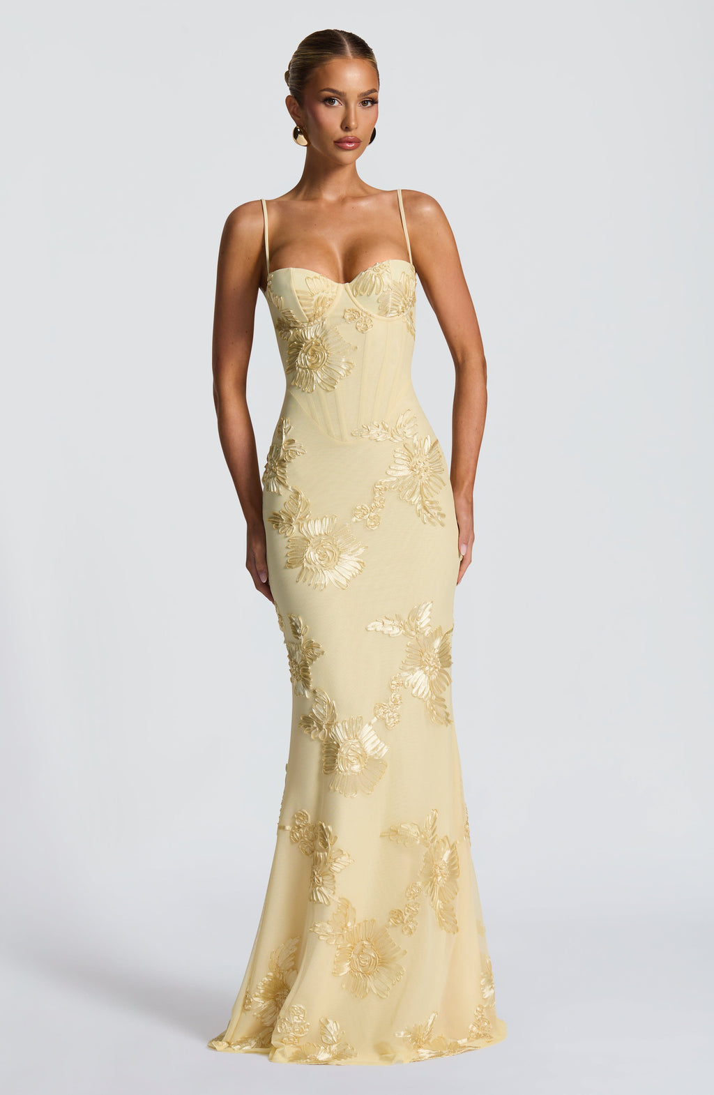 Yellow - Women's pale yellow formal floor-length gown featuring a structured corset bodice, delicate spaghetti straps, and a sheer overlay embellished with intricate 3D floral appliques.
