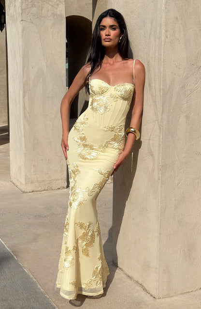 Light Blue - Women's pale yellow formal floor-length gown featuring a structured corset bodice, delicate spaghetti straps, and a sheer overlay embellished with intricate 3D floral appliques.