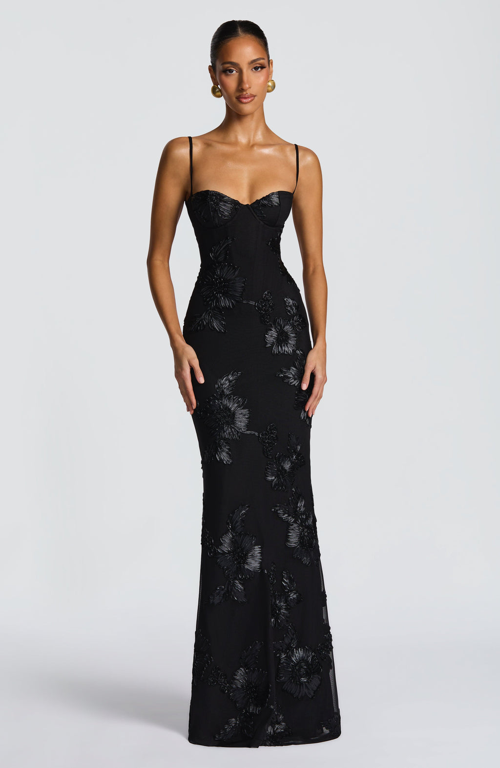 Black - Women's pale yellow formal floor-length gown featuring a structured corset bodice, delicate spaghetti straps, and a sheer overlay embellished with intricate 3D floral appliques.