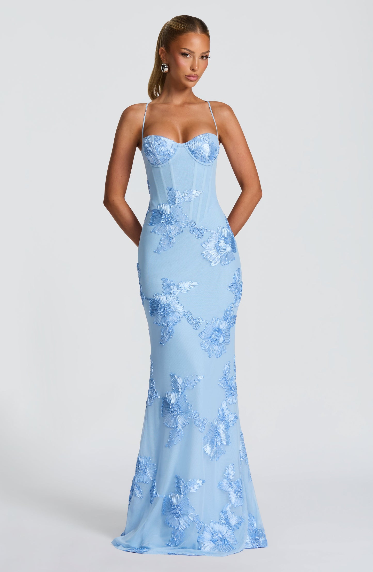 Light Blue - Women's pale yellow formal floor-length gown featuring a structured corset bodice, delicate spaghetti straps, and a sheer overlay embellished with intricate 3D floral appliques.