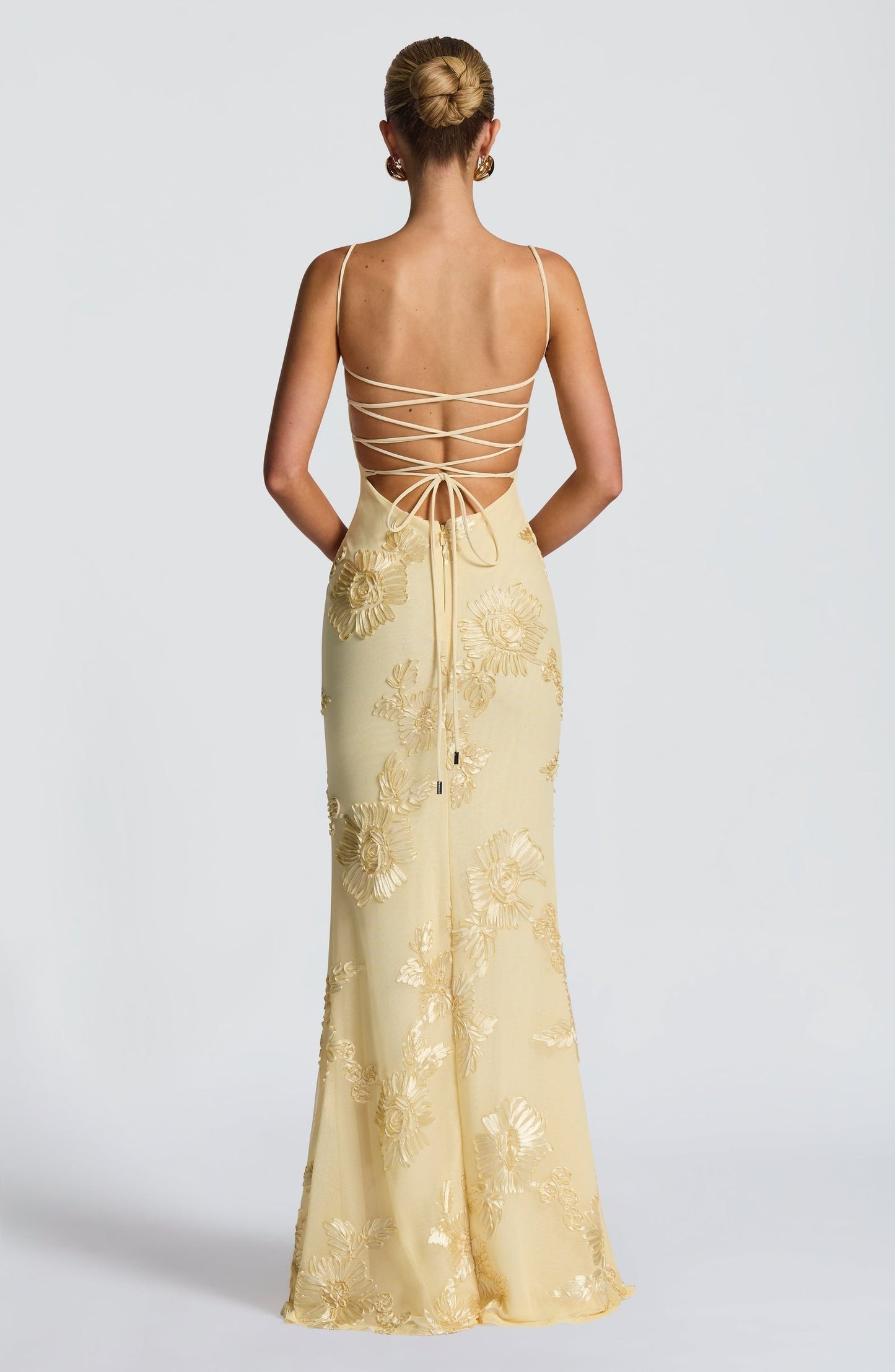 Light Blue - Women's pale yellow formal floor-length gown featuring a structured corset bodice, delicate spaghetti straps, and a sheer overlay embellished with intricate 3D floral appliques.