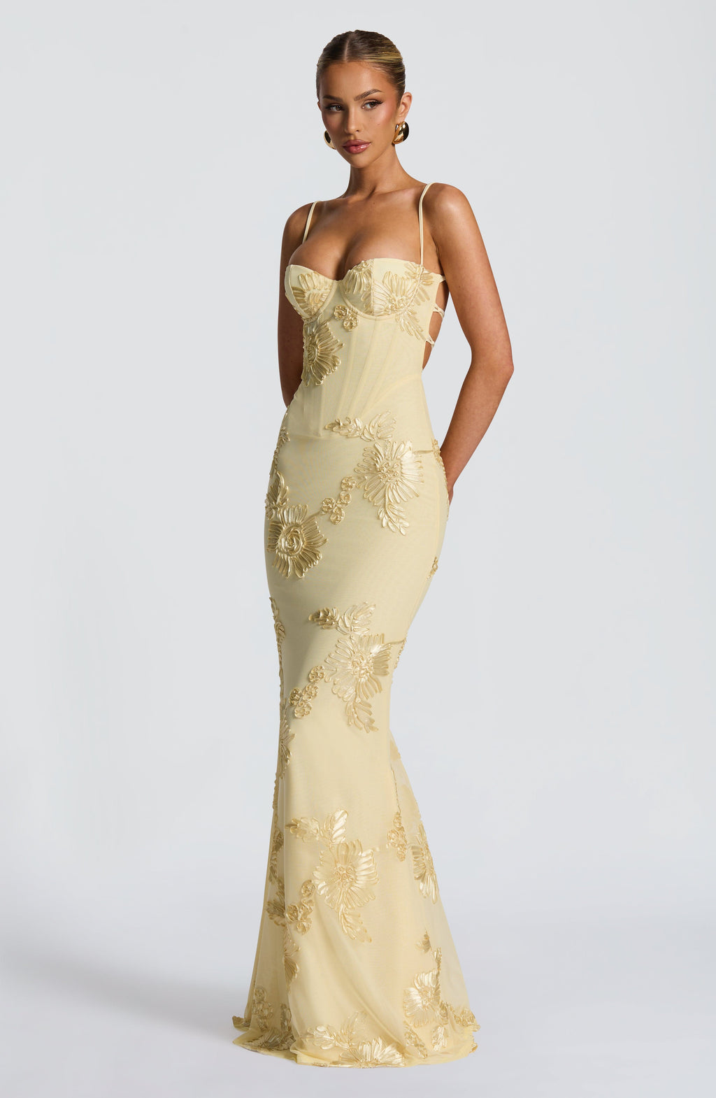 Light Blue - Women's pale yellow formal floor-length gown featuring a structured corset bodice, delicate spaghetti straps, and a sheer overlay embellished with intricate 3D floral appliques.