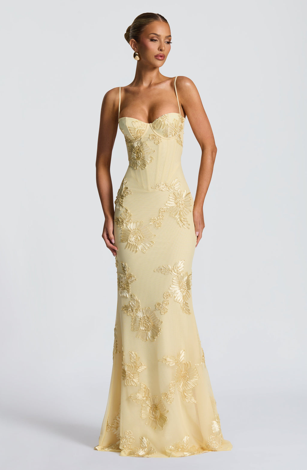 Light Blue - Women's pale yellow formal floor-length gown featuring a structured corset bodice, delicate spaghetti straps, and a sheer overlay embellished with intricate 3D floral appliques.
