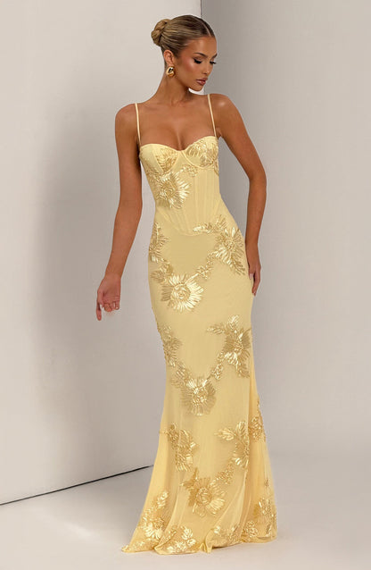 Light Blue - Women's pale yellow formal floor-length gown featuring a structured corset bodice, delicate spaghetti straps, and a sheer overlay embellished with intricate 3D floral appliques.